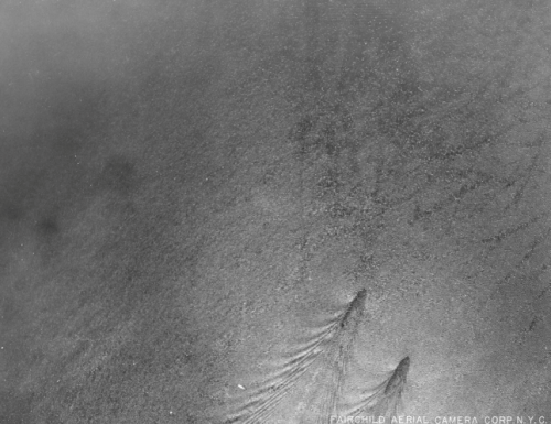 Aerial photograph of a pair of submarines smuggling booze on the Hudson River during Prohibition, Ju