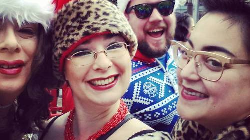 Best santacon #photobomb! @mz_annelise & Mistress B with #uglysweater mystery guy! #santarchy #santacon #santaconsanfrancisco #femdom #mistress #aliceinbondageland #sissy #crossdresser #crossdressing #feminization #transvestite #sissification #drag