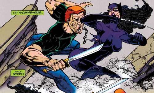 panel from Catwoman vol 2 #53 showing Catwoman in her purple suit being backhanded by a guy with a knife, she's in a pose where she's in the air, her legs are bent at the knee and her feet pressed up against her butt like she's kneeling, her back is arched 90 degrees and we can see both her breasts