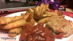 thatblackveganguy:  Uh, I just love spoiling myself with food.. What we have here is a grade A vegan faux seafood meal. A crabcake, breaded shrimp, and cajun fries with a side of cocktail sauce. Vegan Marylanders rejoice in the sight of vegan seafood