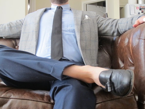 Pairing black with medium blues can make it less formal.
Houndstooth with blue overcheck jacket. Blue OCBD. Black grenadine tie. Black and white dotted square.
Navy chinos. Black tassel loafers. Sockless.