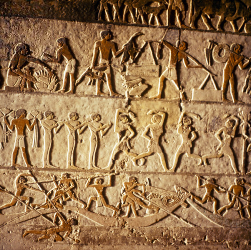 A painted relief from the tomb of Nefer at SaqqaraMiddle register: Dancers. Lower register: Fighting