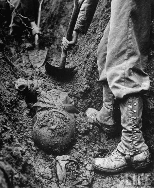 historicaltimes:“Retreating medical convoy team digging up body of American medic who was buried in 