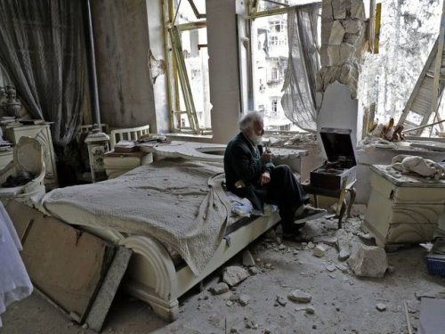 Above is a photograph taken by Joseph Eid in Aleppo, Syria. It portrays a man, Mohammed Mohiedin Ani