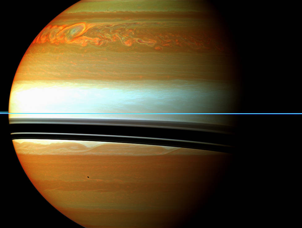astronomyblog:  Saturn’s atmosphere exhibits a banded pattern similar to Jupiter’s,