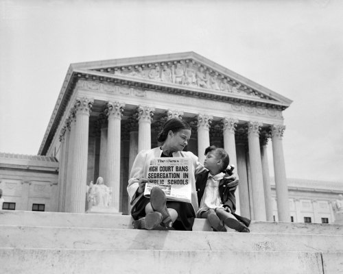 Nettie Hunt And Her Daughter Nickie Sit On Steps Of The US Supreme Court Building On May 18, 1954, The