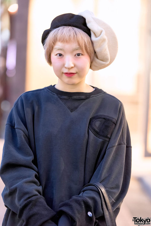 22-year-old Dee on the street in Harajuku wearing a resale Champion sweatshirt, ripped Levi’s,