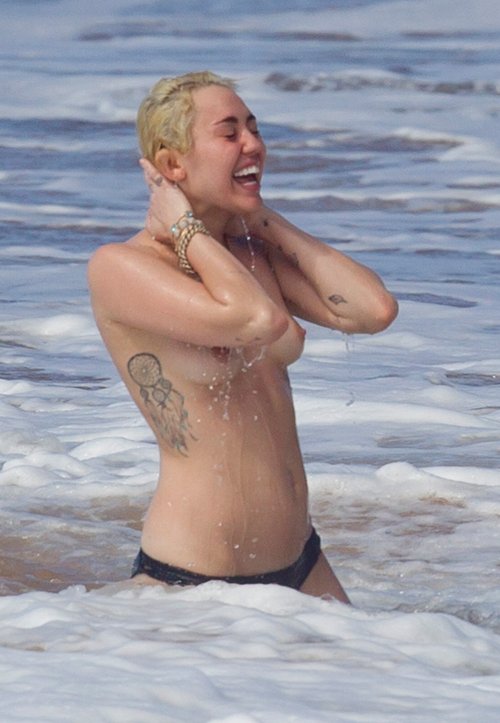 hotcelebshd:  Miley Cyrus Topless in Hawaii HQ Pictures ALL PICTURES: Click 