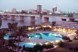 africansouljah:  Steve McCurryIRAQ. Baghdad. 1984. The Tigris with two of its twelve city bridges, Al Mansour Melia Hotel.