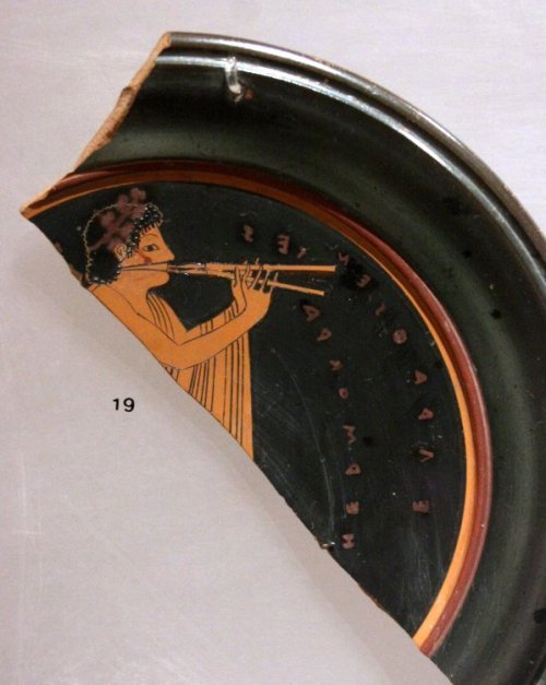 hildegard-von-bingen:Fragment of an Attic red-figure plate showing an aulos player.  The inscription