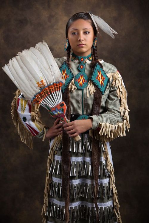 Native American dancers. Jingle Dress is a Native American Powwow dance performed by women. The rega