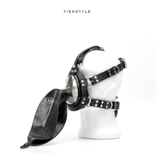 tiedstyle:Venom II-R: Anesthesia mask with a leather harness and rebreather bag.The “R” in the class
