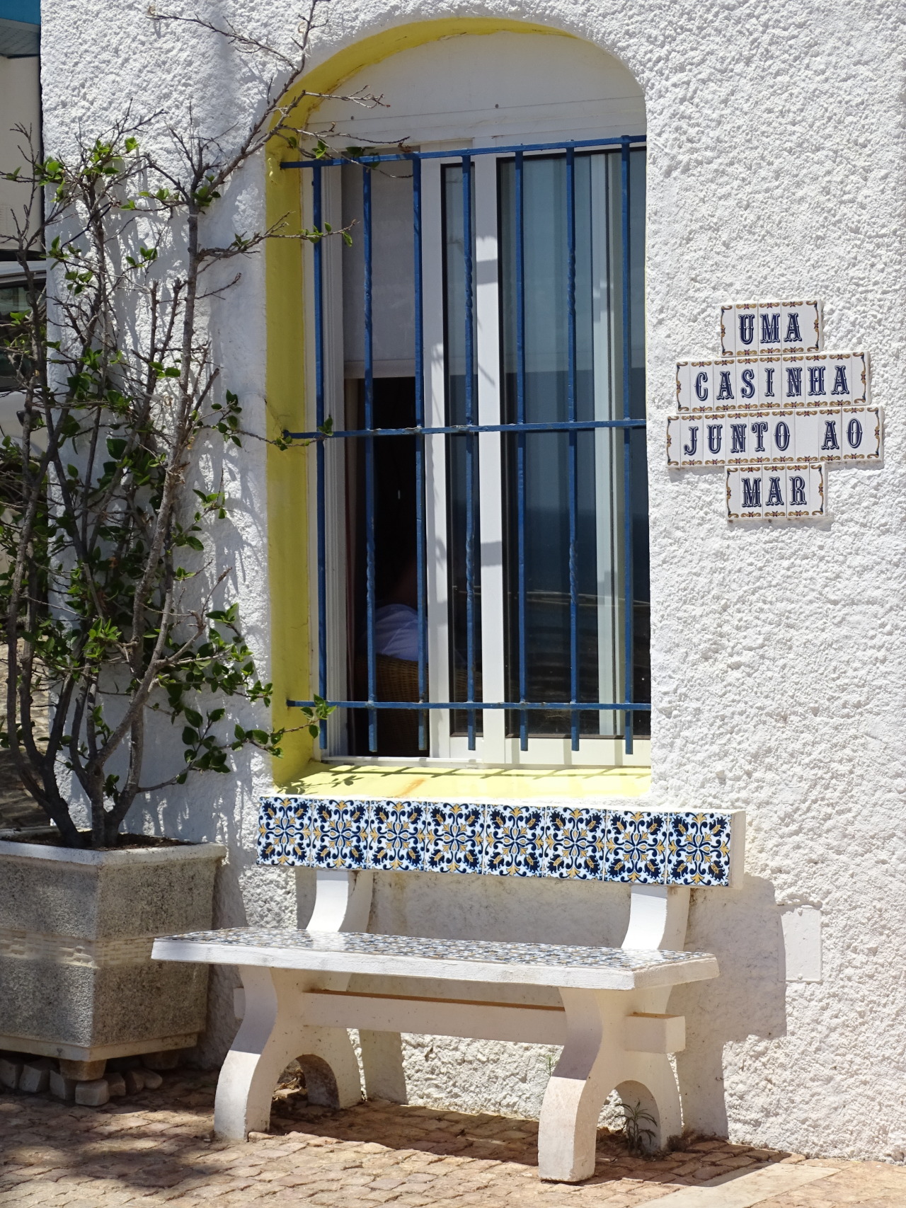 Invitation to RestWhat do you think about my pic?     #Albufeira#Algarve#Portugal#bench#window#gate#white house#travel#flower pot#original photography#cityscape#tourist attraction#landmark#architecture#summer 2021#Iberia#Southern Europe #photo of the day  #What do you think about my pic? #yellow#blue#tiles#vacation#façade#exterior