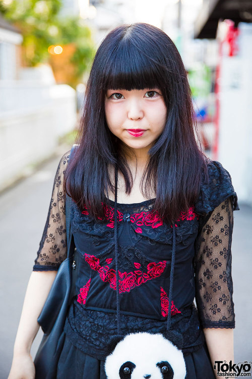 Japanese students Maoko and Zunyan on the street in Harajuku with matching panda pouches. Maoko is w