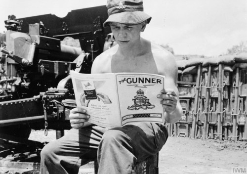 A British gunner serving in Korea reads The Gunner, the regimental journal of the Royal Artillery (A