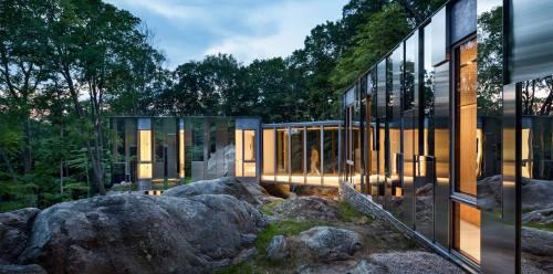 thekhooll:Pound Ridge HouseKieranTimberlakeThe site for this home is a south-facing, boulder-strewn escarpment that rises over a hundred feet, from a wetland to the top of a ridge. The owners were drawn to the almost magical sense of tranquility they