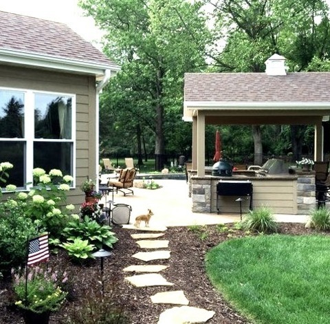 Fire Pit St LouisPhoto Of A Large Traditional Partial Sun Backyard Stone Landscaping With A Fire Pit