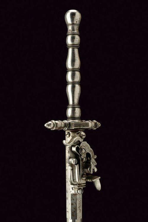 art-of-swords:  Combination Dagger with Flintlock Gun Dated: 19th century Culture: European Measurements: overall length 38.5 cm The dagger has a cusp of triangular section, assembled on a long neck of round section, faceted and octagonal at the base.