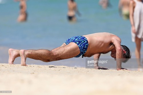 bizarrecelebnudes:  Andrew O’Keefe - Aussie Tv Presenter (Part 1) Love him. He always loves showing of in speedos by the beach. Love his hairy body. 