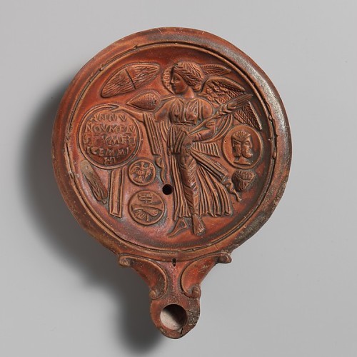 ancientpeoples:Terracotta oil lamp with winged Victory Early Imperial Roman, 1st half of second cent