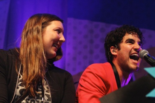 Darren Criss with a fan on stage in concert at The Fillmore in San Francisco, CA