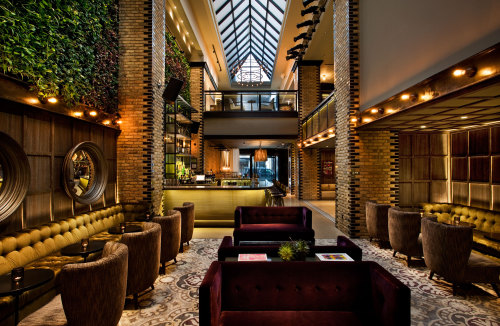 {Feeling the vibe of this hotel by Tara Bernerd. The common areas feel cozy and masculine, with hint