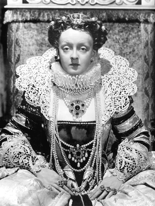 wehadfacesthen:Bette Davis in costume as England’s Queen Elizabeth I for The Private Lives of Elizabeth and Essex (Michael Curtiz, 1939)