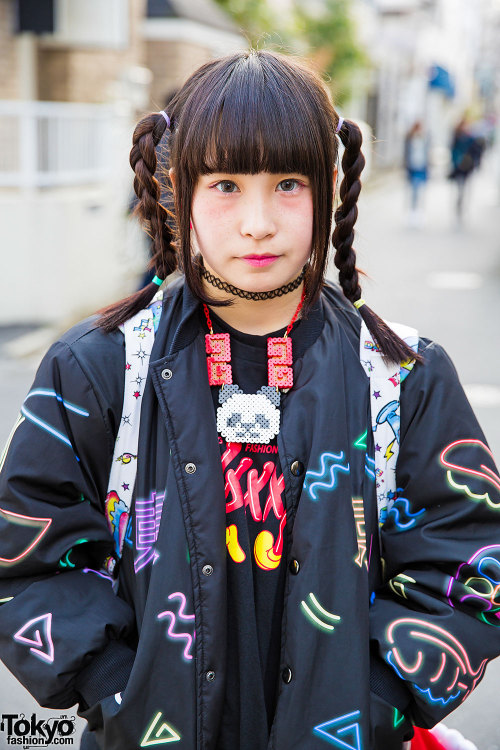 Aipanda and Tashu - both 17 years old - on the street in Harajuku wearing graphic outfits by Galaxxx