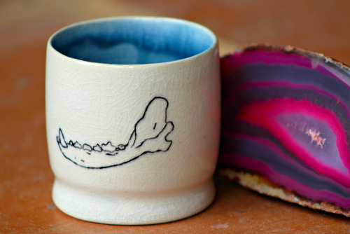 xcatalicious:  This one’s for my tea drinking homies! Wheel thrown porcelain tea cup with human teeth and dog jaw bone hand painted on opposite sides covered in a cracking clear glaze. You can buy it right hurrrr if you want…not trying to force anything,