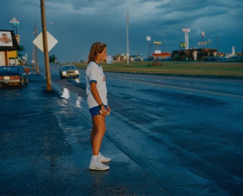 taces:  Girl blowing bubble gum, South Dakota, USA, 1986. by Michael Ormerod