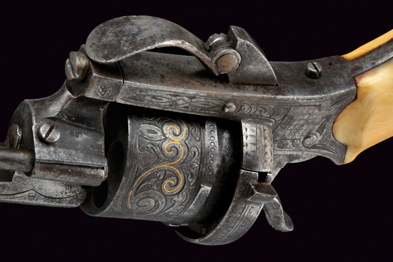 peashooter85:  An engraved ivory handled folding trigger pinfire revolver originating