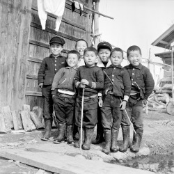 uncannyvalleyofthedolls:  Japanese schoolboys in rainboots, circa 1955. 