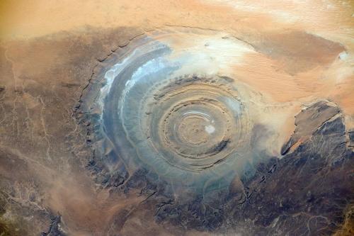 amazinglybeautifulphotography:  Gaulb er Richat structure in Mauritania. Located in the Saharan desert, it is a 25 mile diameter geologic dome [1280 x 852] - Author: derzto on reddit