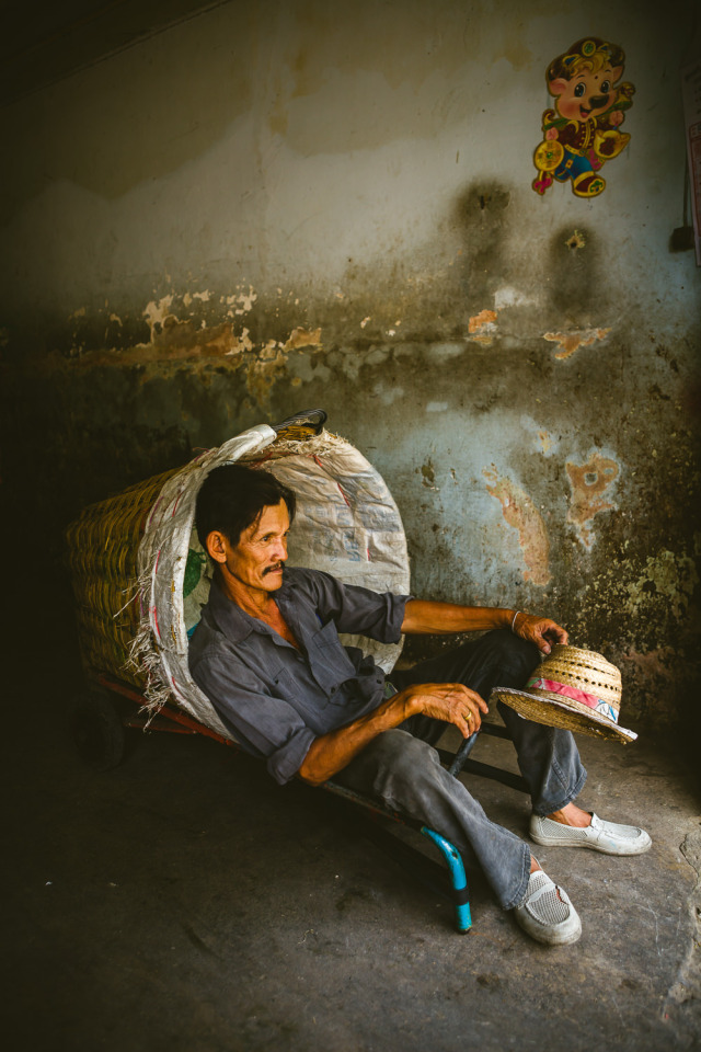 Porters ferry purchases from the warehouses to waiting trucks and tuk-tuks. It’s tiring work,...