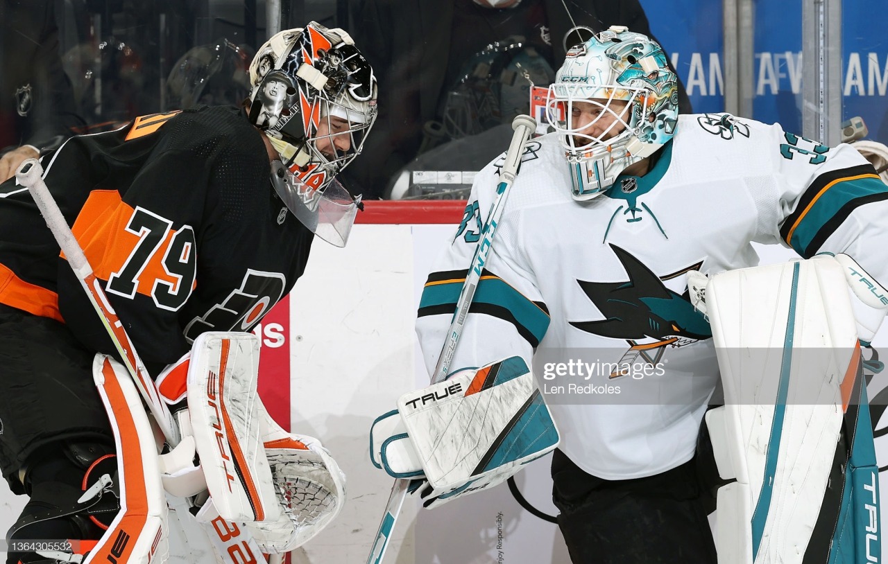 PHILADELPHIA, PA - JANUARY 08: Carter Hart #79 of the Philadelphia Flyers chats with Adin Hill #33 of the San Jose Sharks during warm-ups at the Wells Fargo Center on January 8, 2022 in Philadelphia, Pennsylvania. (Photo by Len Redkoles/NHLI via Getty Images) #carter hart#adin hill#goalies#sharks#flyers #sorry for the getty spam this morning i just thought this picture was cute!!!  #when the goalies chat together >>>>