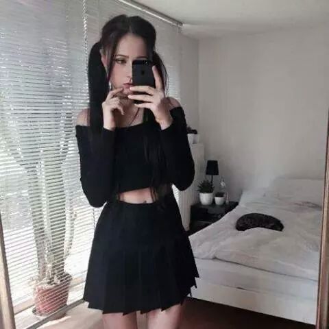 pleatedminiskirts:  She is great! Ever so slightly gothic? The skirt is great (American