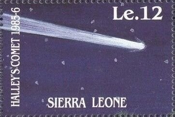 a postage stamp with a simple illustration of a Hailey’s Comet in the night sky. the comet is a streak of white. faint stars dot the background.