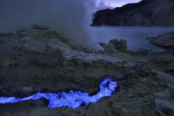 coolthingoftheday:  Indonesia’s Kawah Ijen is a volcano near East Java that erupts blue lava from its crater. The volcano spews sulphuric gases into the air, which is set ablaze by the heat of the magma, making it appear blue. 