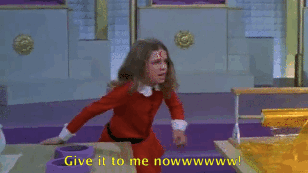 An animated gif of Veruca Salt from Charlie and the Chocolate Factory - a little girl in a red dress screaming "Give it to me nowwwwww!"