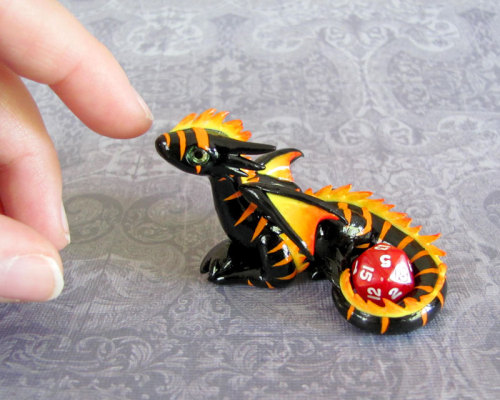 tomarou:  rosesakurax:  thatfilthyanimal:  ensorevolution:  Tiny Dragons That Take Care of Your Gaming Dice http://www.themarysue.com/dice-dragons-becca-golins/#0  [SCREAMS] I WANT THEM  Cuteee  I couldn’t resist reblogging; NO REGRETS 