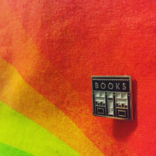 This awesome Kickstarter is selling these beautiful pins for an amazing cause: The Queens Bookshop I