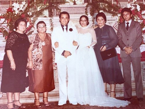 My parents’ wedding pic. Everybody is so serious! My mom looking gorgeous, my dad looking like a maf