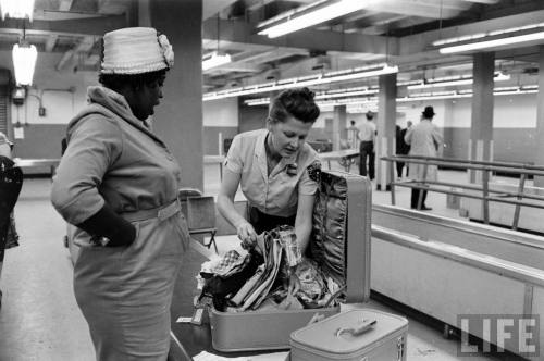 Going through customs(Carl Mydans. 1964)