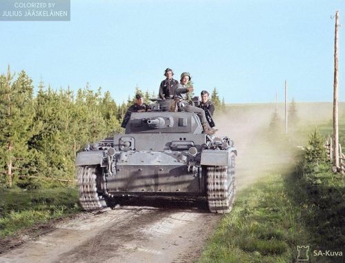 A German Panzerkampfwagen III On It's Way To The Frontlines. There Is Also A Finnish TK-correspondent