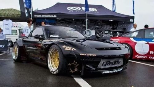 vagina-tickler:  stancedautos:  The real life end result of the renderings  I still dislike rocket bunny cars but damn the rear overs go really well on the fd the rest of the kit looks like poop still, front bumper makes the car look like it has a stupid