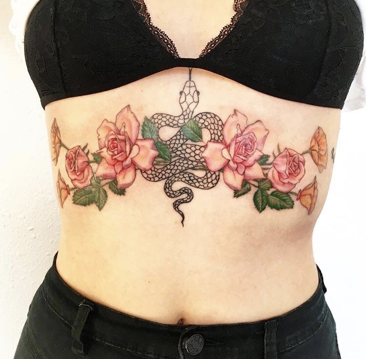 One line rose tattoo on the sternum