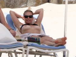 toplessbeachcelebs:  Chelsea Handler (TV Host) with bikini top pulled up in Mexico (March 2016) 