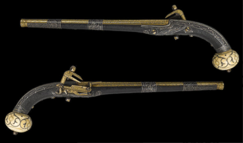 A pair of gold, silver, and ivory decorated miquelet pistols originating from Dagestan, 19th century