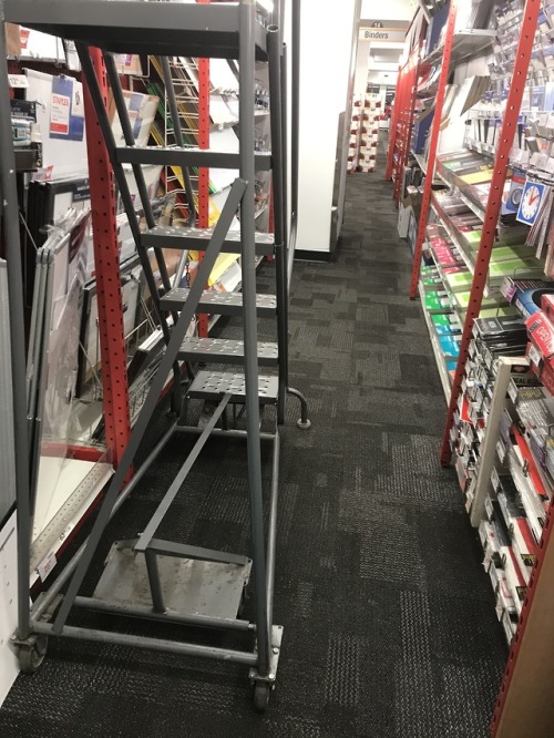 Already too-narrow aisle at Staples made completely impossible to get through in a wheelchair by a c