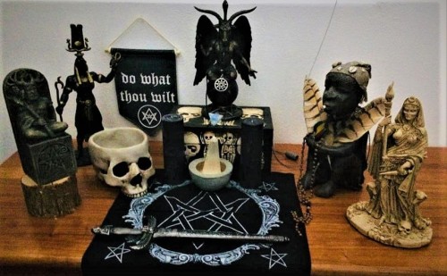 This is my altar, which is ALWAYS a work-in-progress. At the center, is Baphomet resting upon the sk